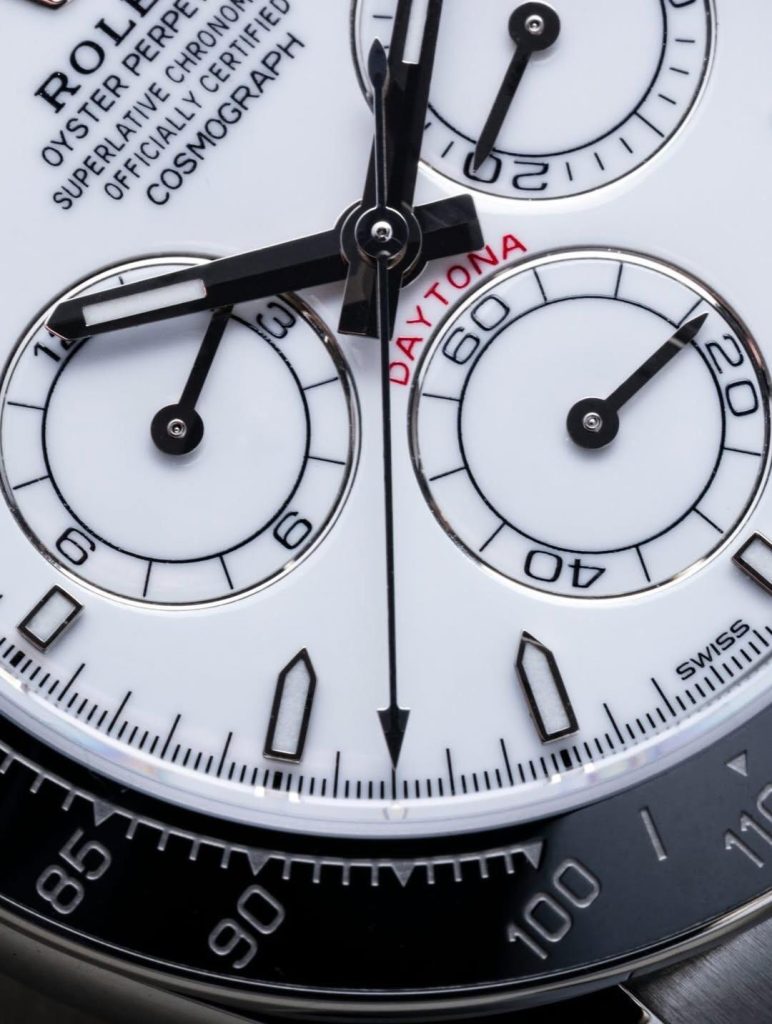 High-resolution macro shot of the VSF Daytona white dial, crisp red DAYTONA text, and sub-dials
