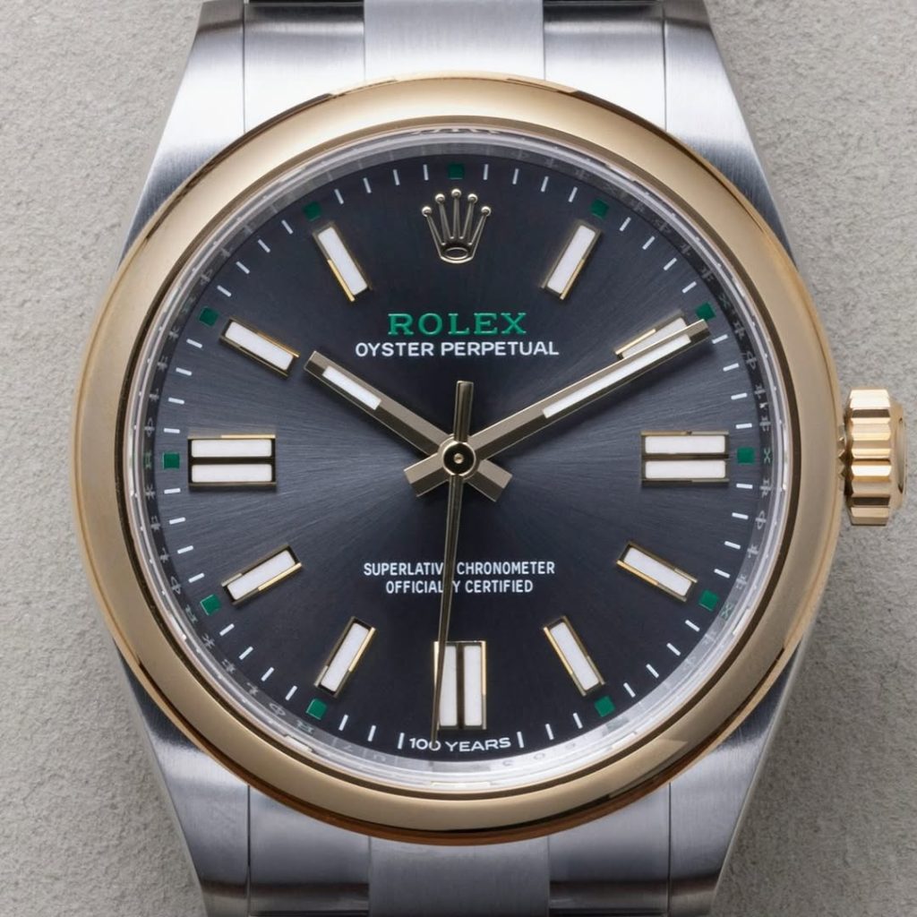 Full frontal alignment showing hand clearances, dial symmetry, and rehaut engraving.